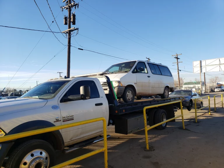 Non-running minivan picked up on Jorge's flatbed tow truck in Thornton, CO